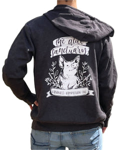 Woman wearing a dark grey hoodie with words on the back that say "The Alice Sanctuary - kindness, compassion, love" printed above a drawing of a pig.