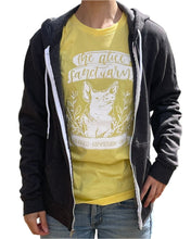 Load image into Gallery viewer, Woman wearing a dark grey unzipped hoodie over top of a bright yellow t-shirt that says &quot;The Alice Sanctuary - kindness, compassion, love&quot; printed above a drawing of a pig.
